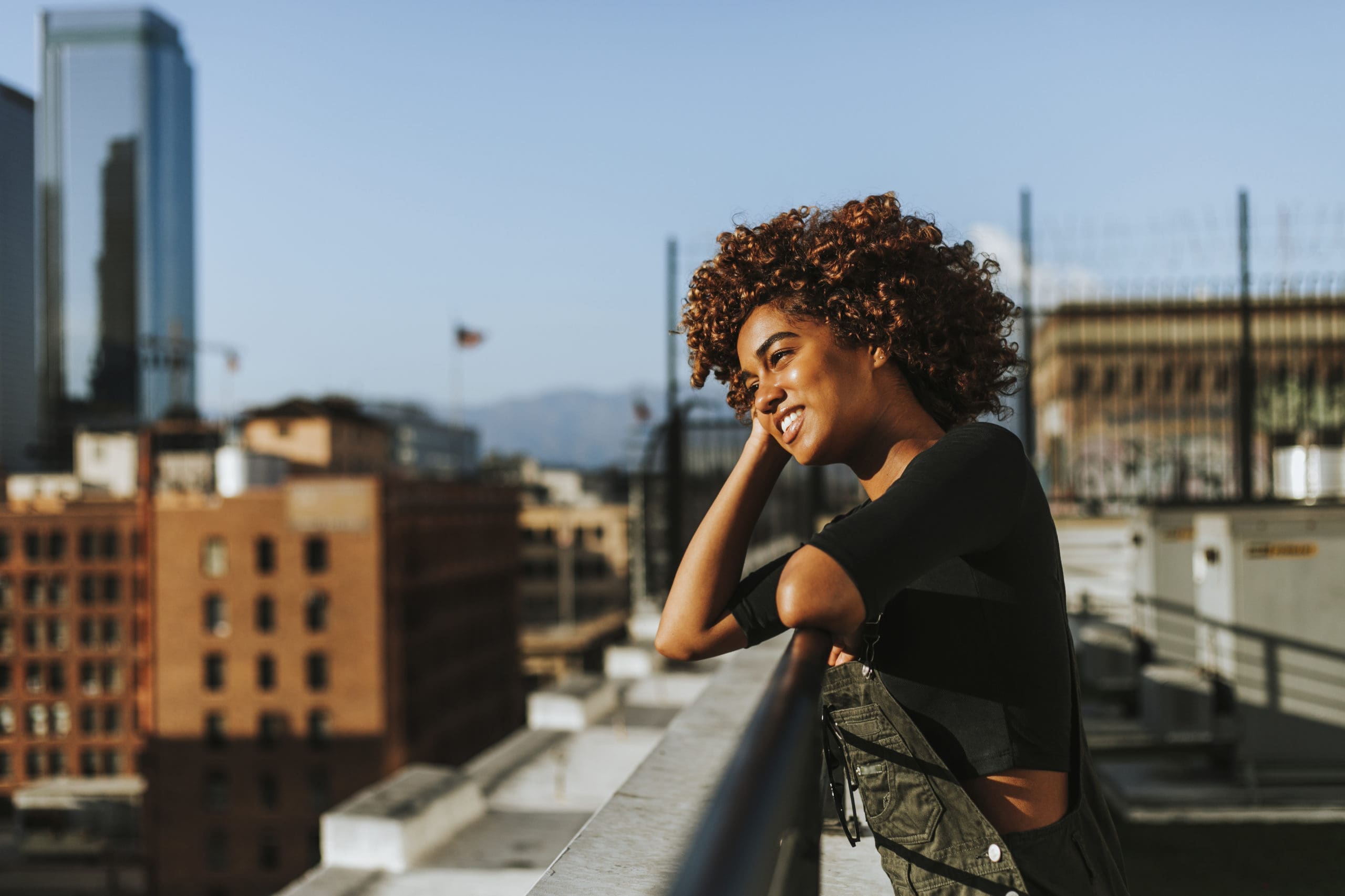 Girl with curly hair at a LA rooftop